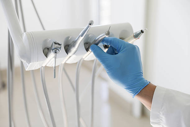 Professional Tooth Extraction technician working in Bondurant, IA